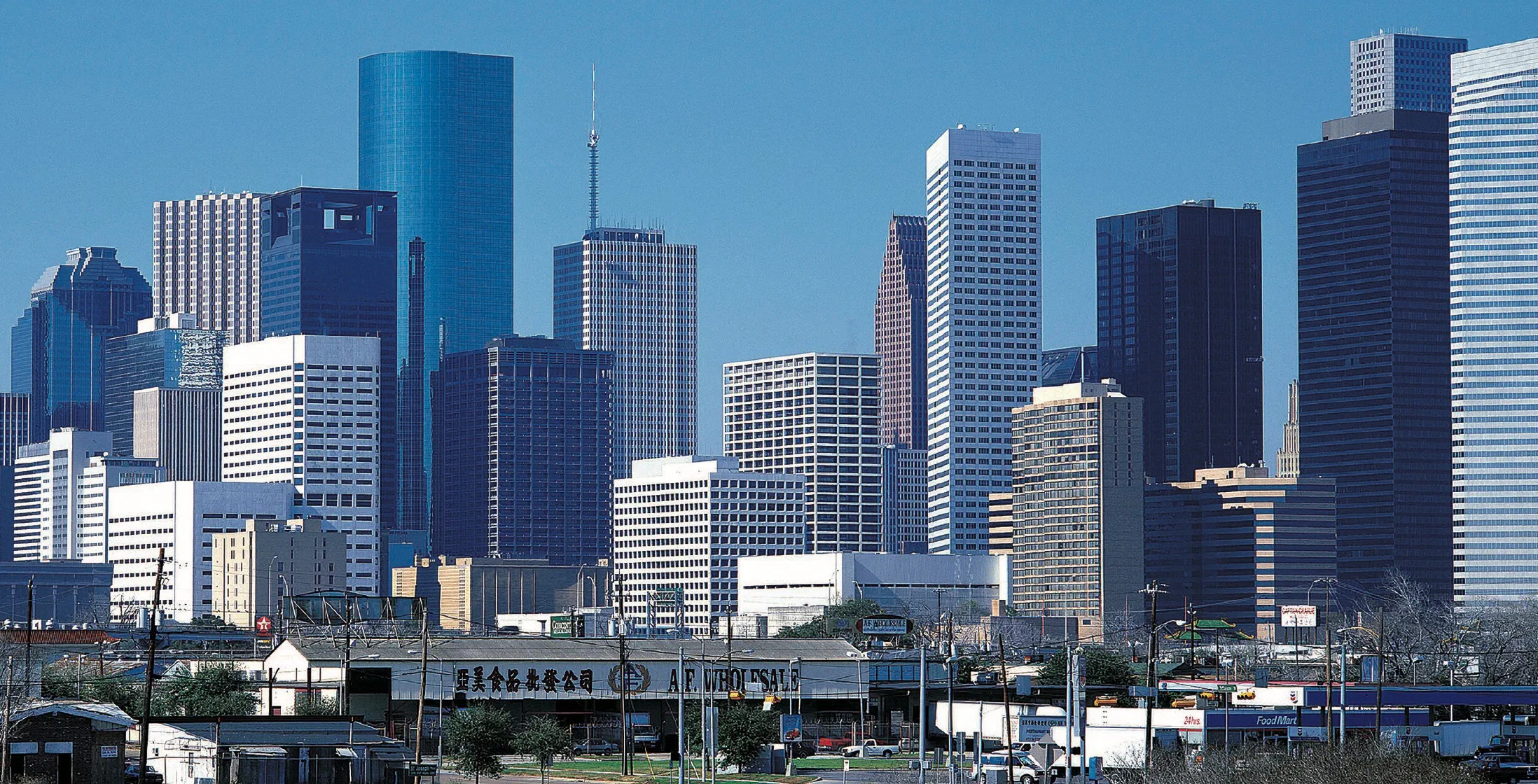 Downtown Houston skyline under a clear blue sky
